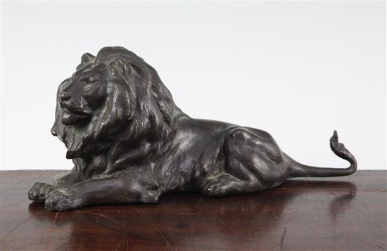 A patinated bronze model of a recumbent lion, 9in.